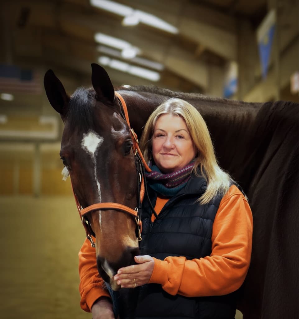 A HEROS rehomer with her bay Thoroughbred